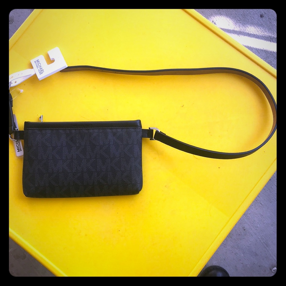 Black Michael Kors belted wallet.